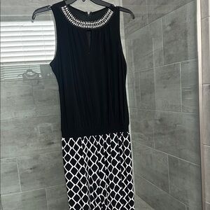 Sleeveless Black and White Patterned Women's Jumpsuit with Embellished Neckline